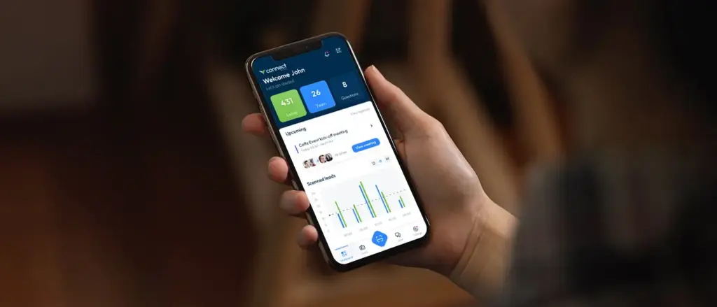 Visit Connect lead retrieval app showing captured leads on a smartphone