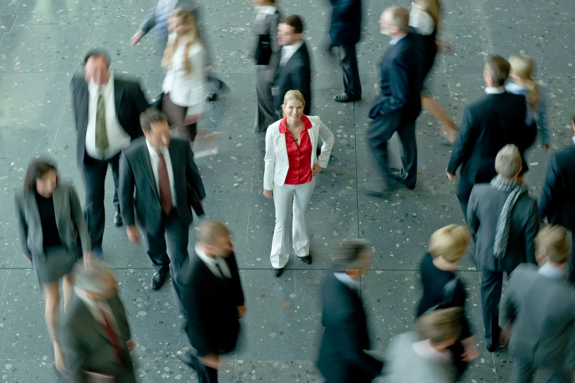 Trade show crowd with one attendee in focus representing buying intent